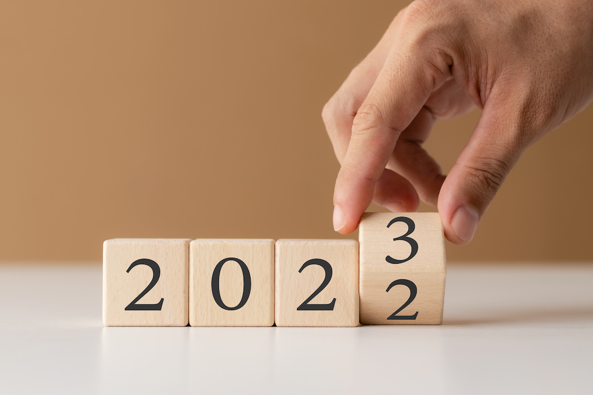 2023 new year goal planning idea, wood block cube with new year 2023 and target icon, business vision.