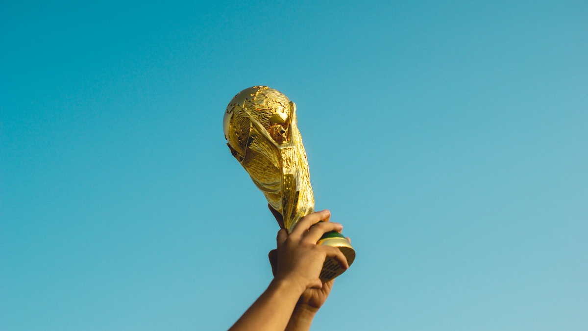 person-holding-trophy